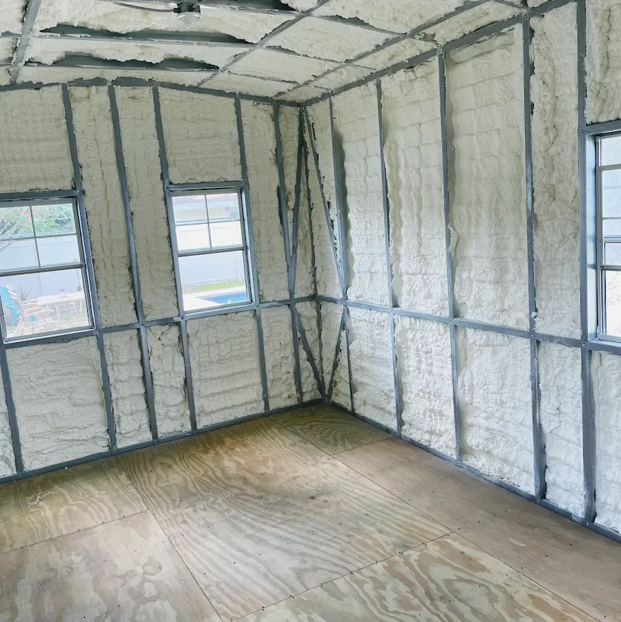 Closed-cell spray foam insulation applied to wall cavities in a residential project in Volo